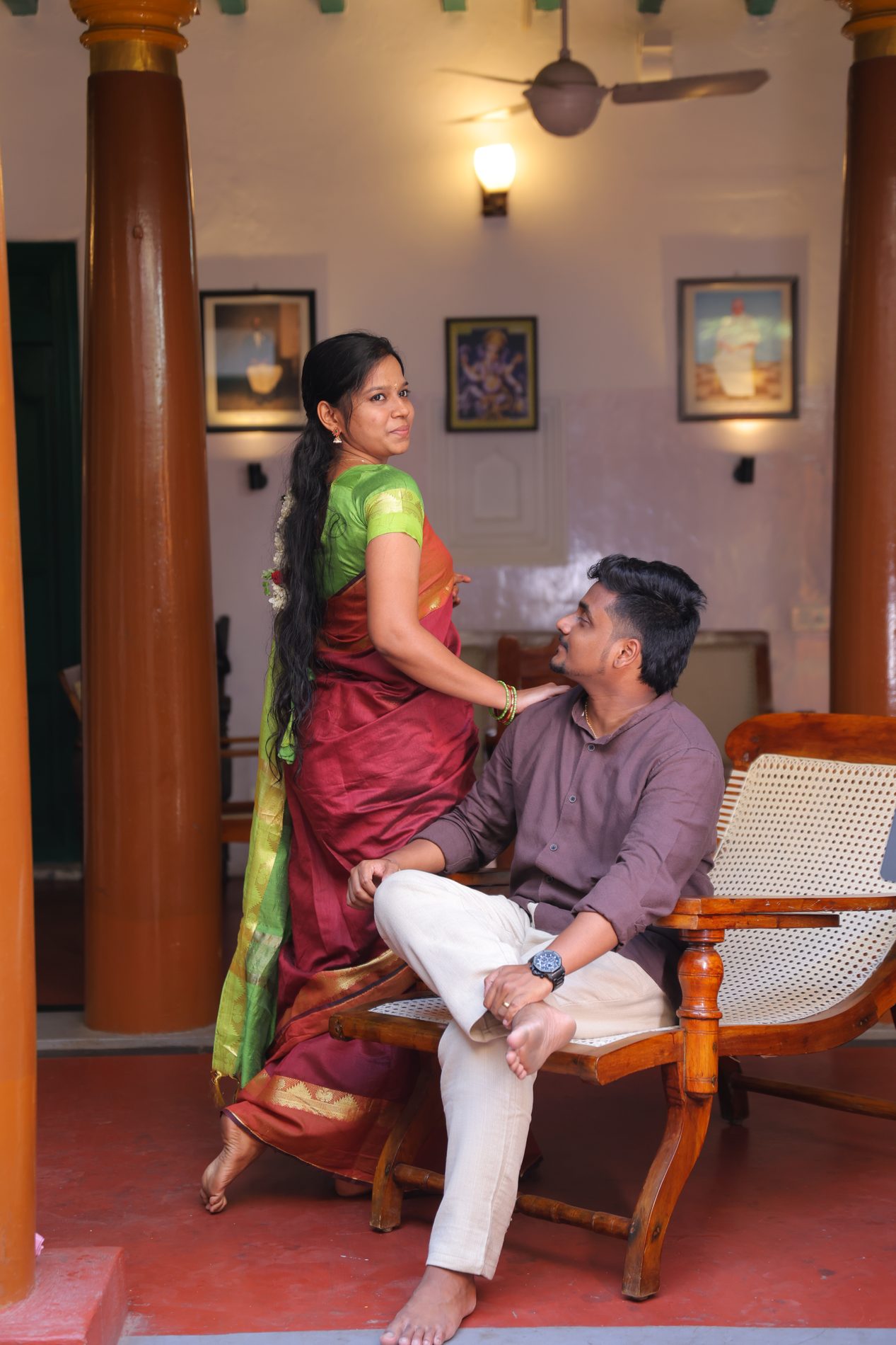 Venkatesh and Brindha in the colourful pillared courtyard